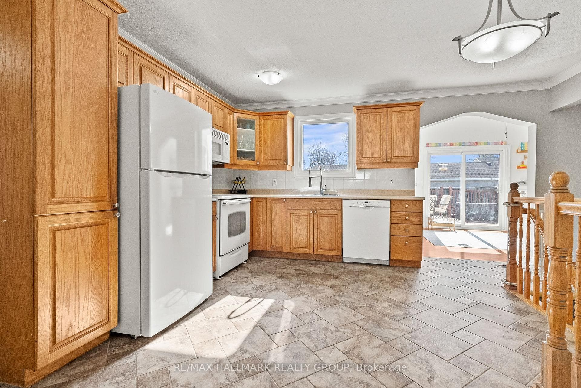 Kitchen open to sun-filled addition