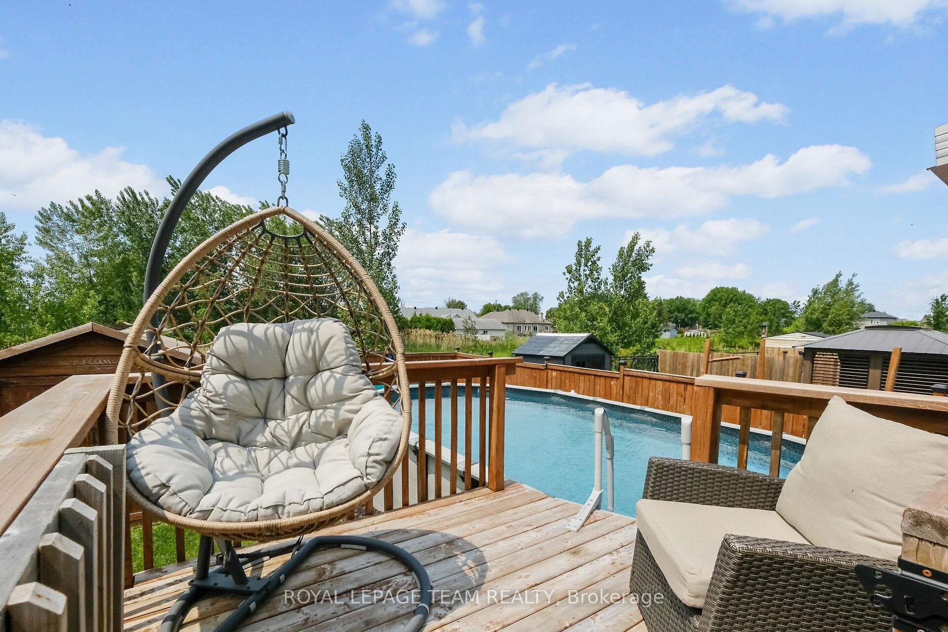 Deck with access to above-ground pool.