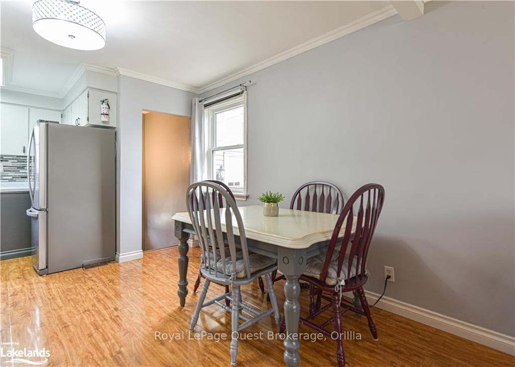 Dining room with washer / dryer, light hardwood /