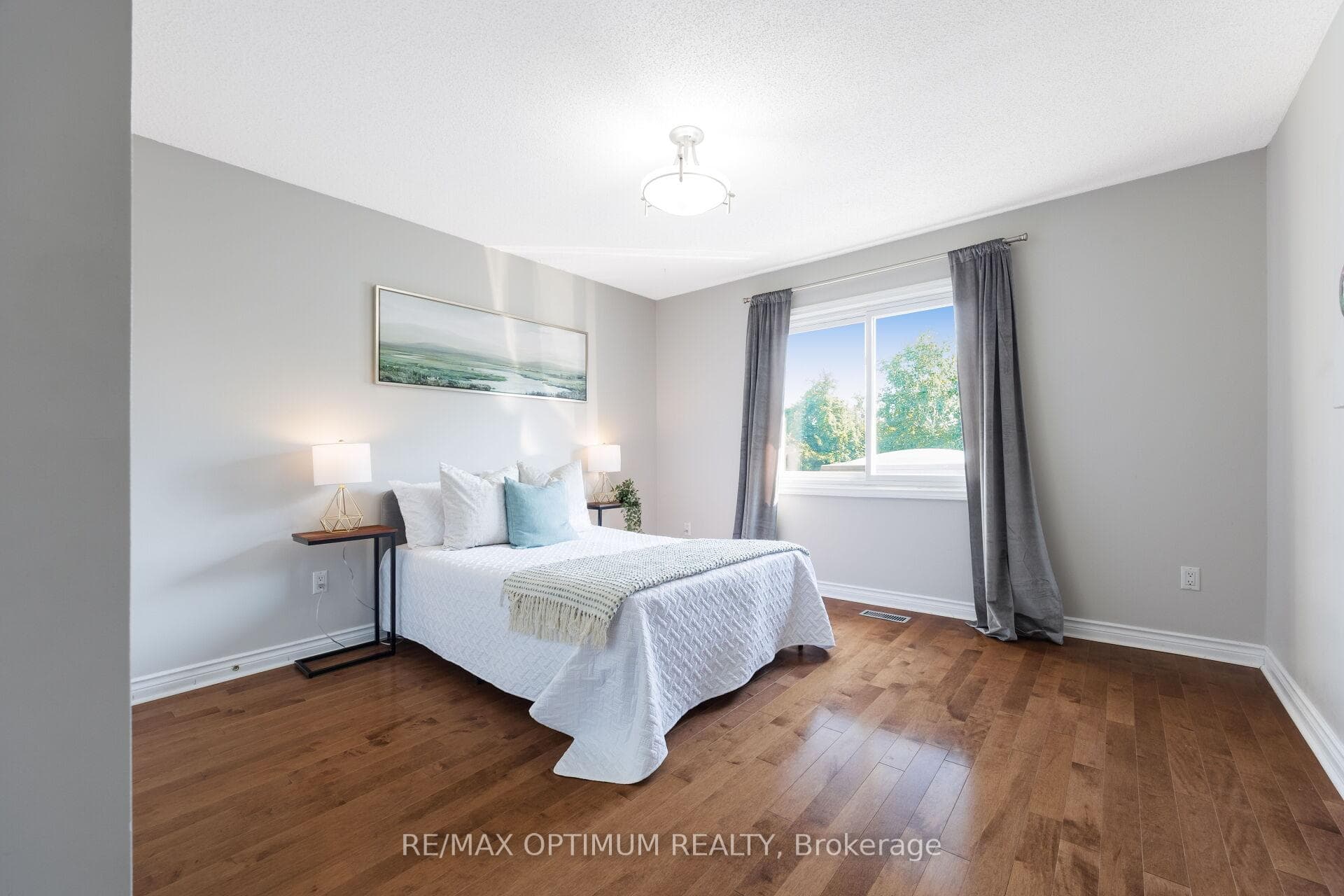 Bright bedroom with hardwood floors