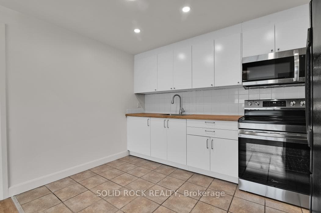 Renovated kitchen with bright white cabinetry