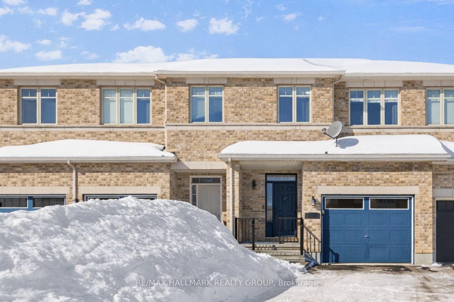 Brick exterior townhouse with garage
