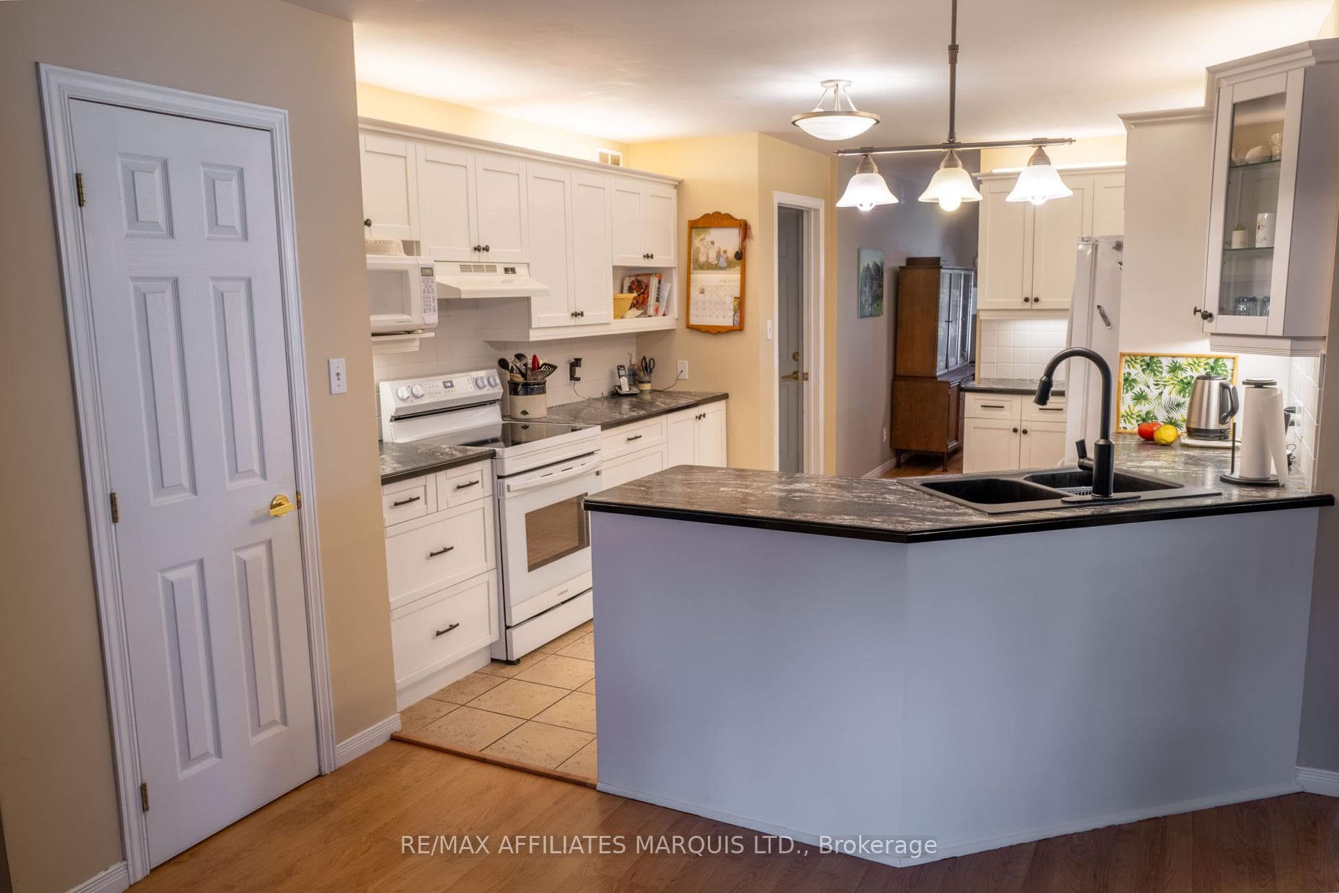 Kitchen has lots of cabinets and counter space