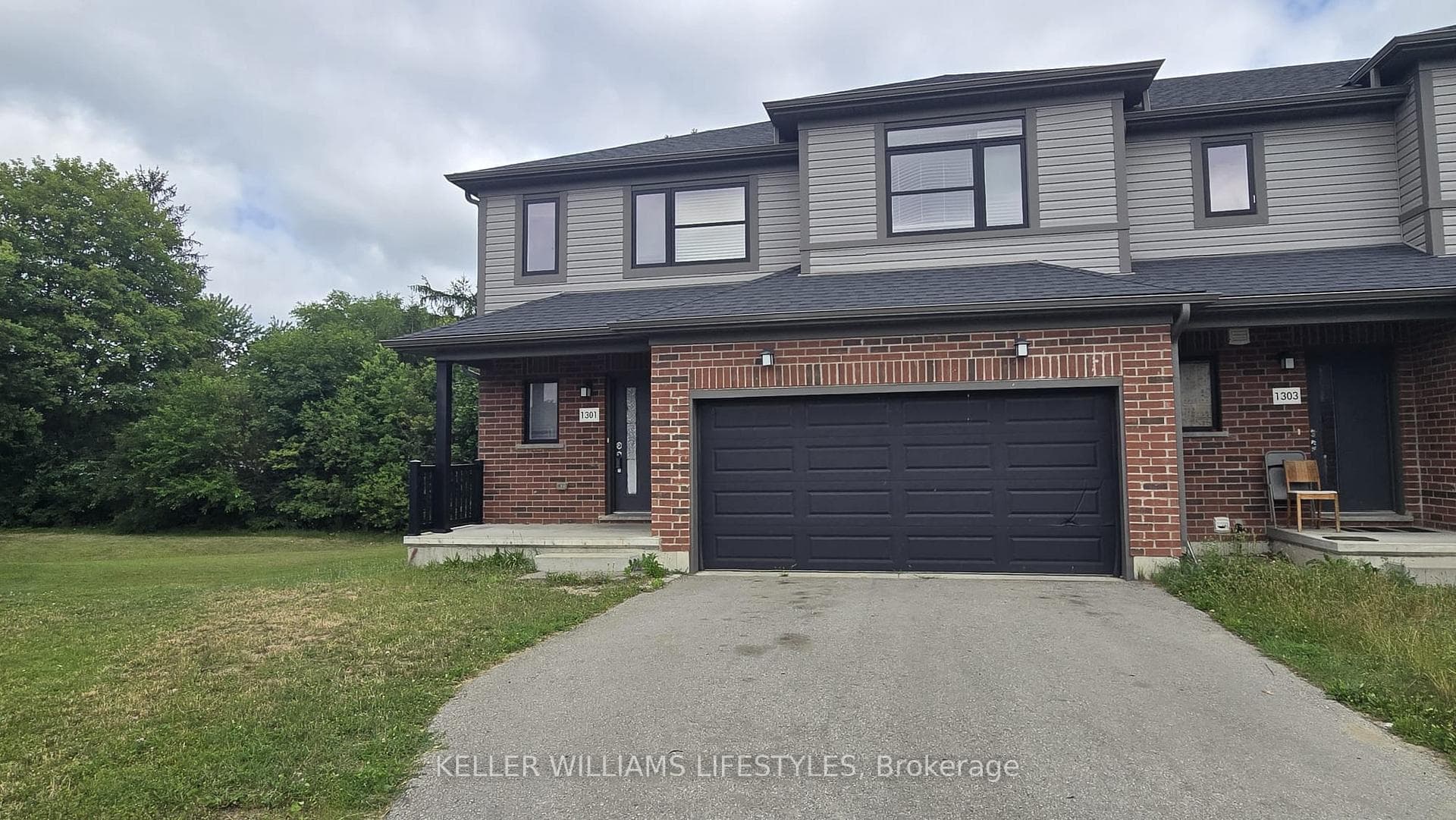 Front view with 2 car garage