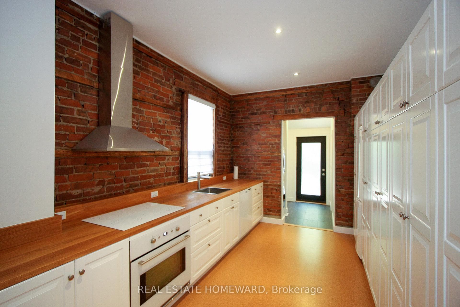 Kitchen showing rear entrance