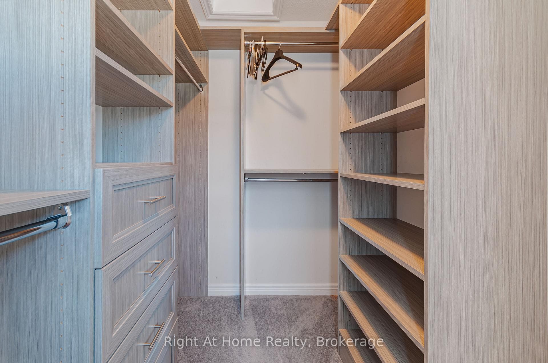 Large walk-in closet with custom built-in wardrobe