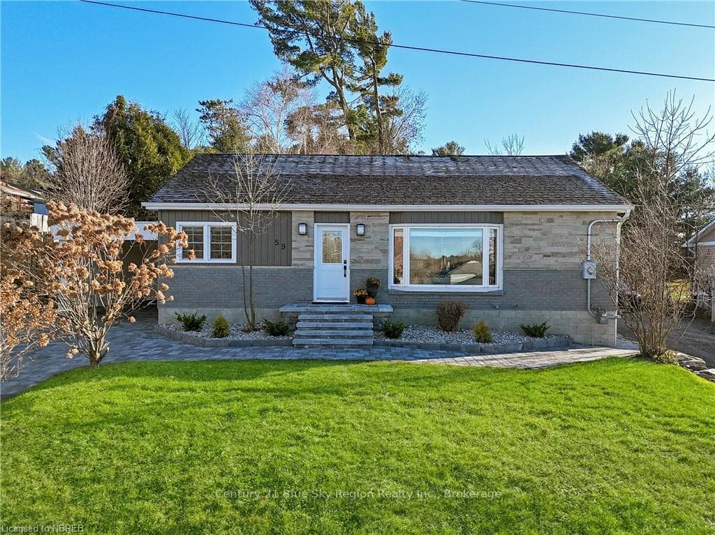 Ranch-style home featuring a front yard