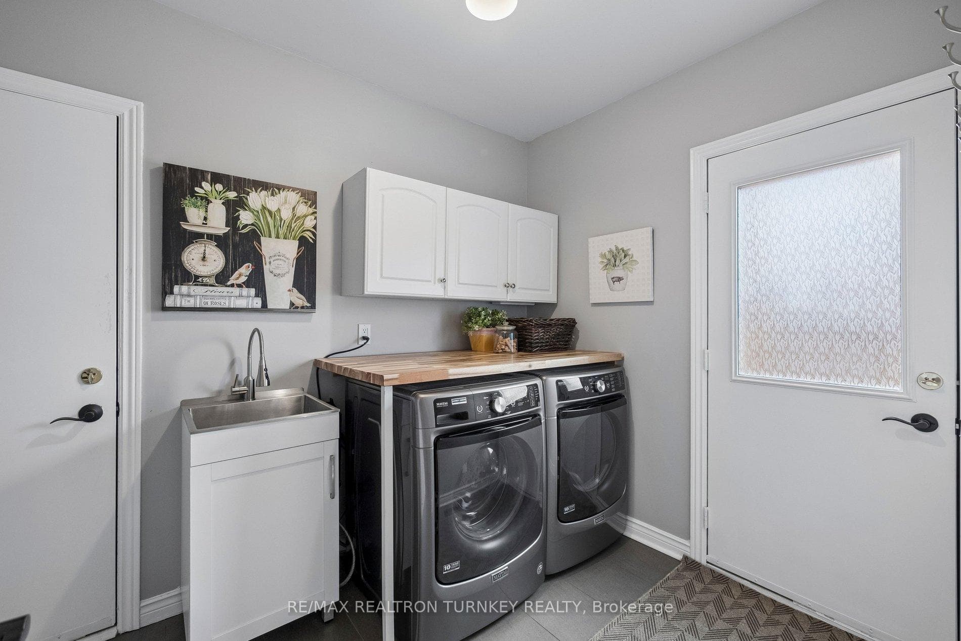 Main Floor laundry with walkout