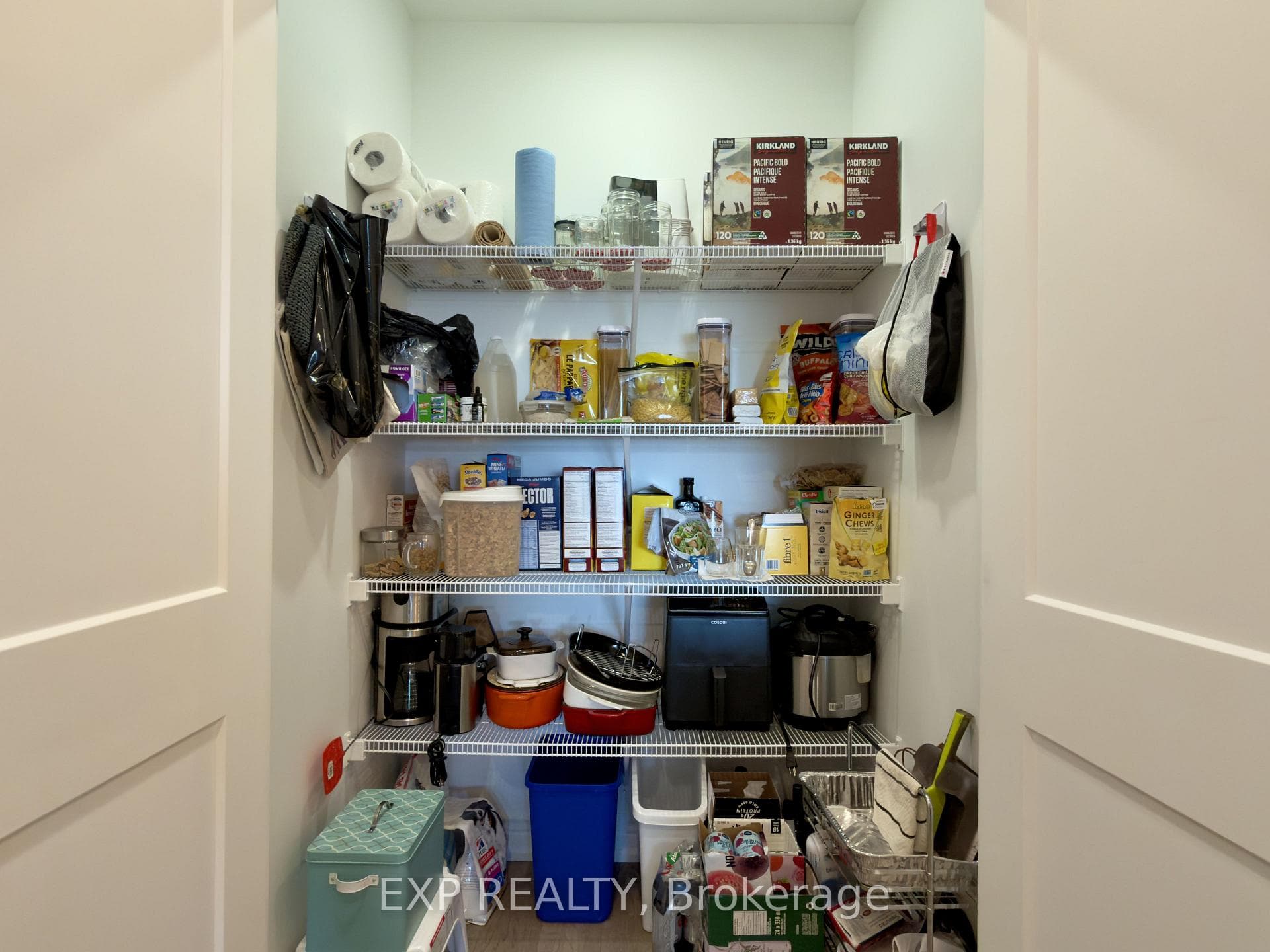 Organized pantry with clean white shelves