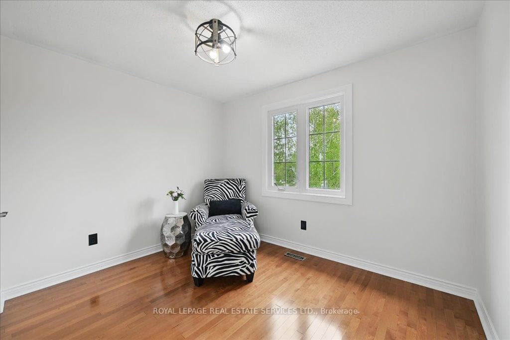 Second Bedroom with Hardwood Flooring