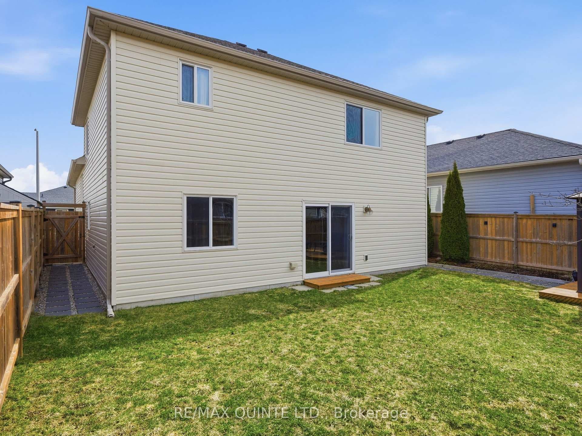 Fully fenced, tastefully landscaped backyard.
