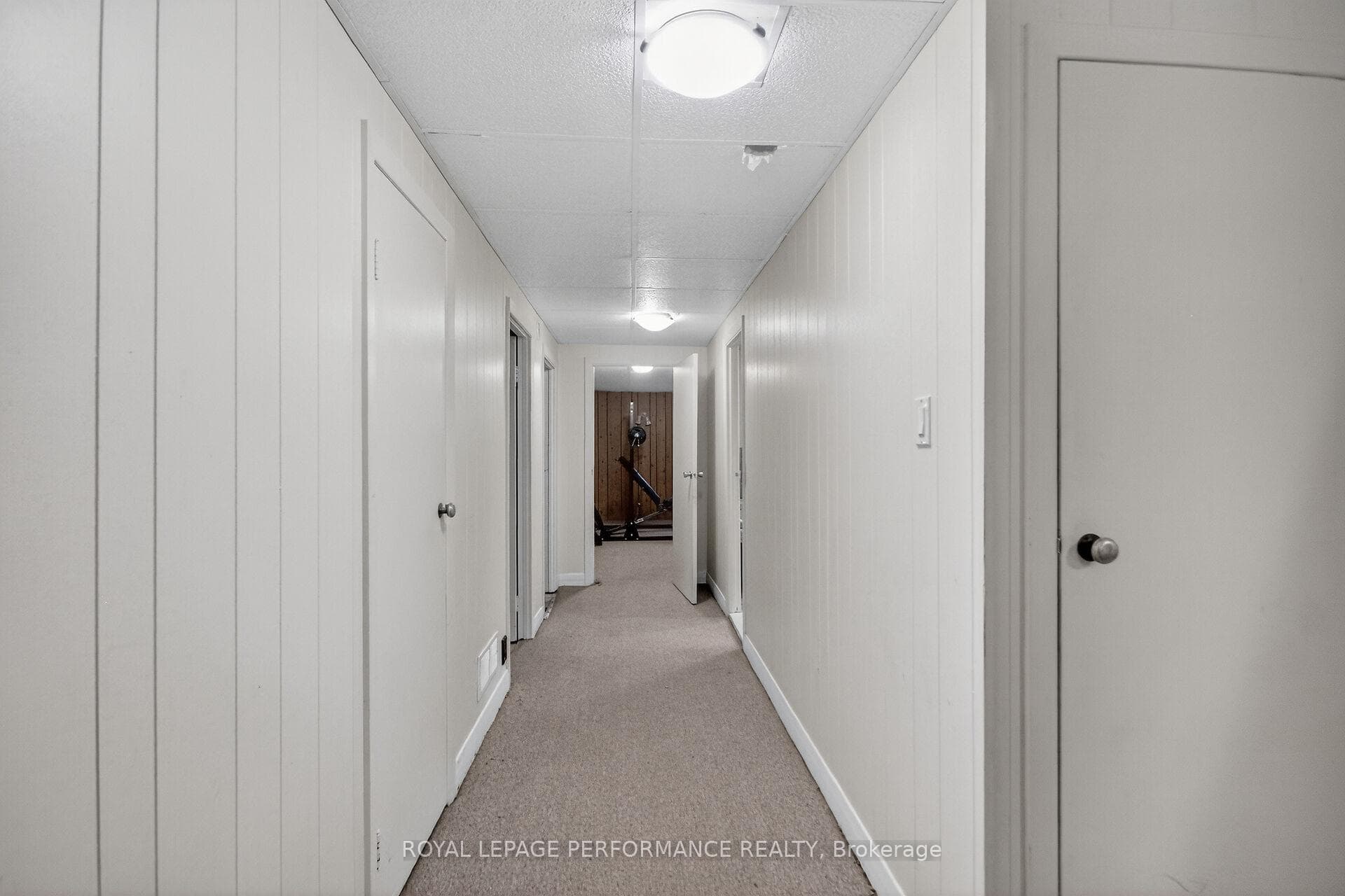 Hallway with 2 closets, door to laundry room