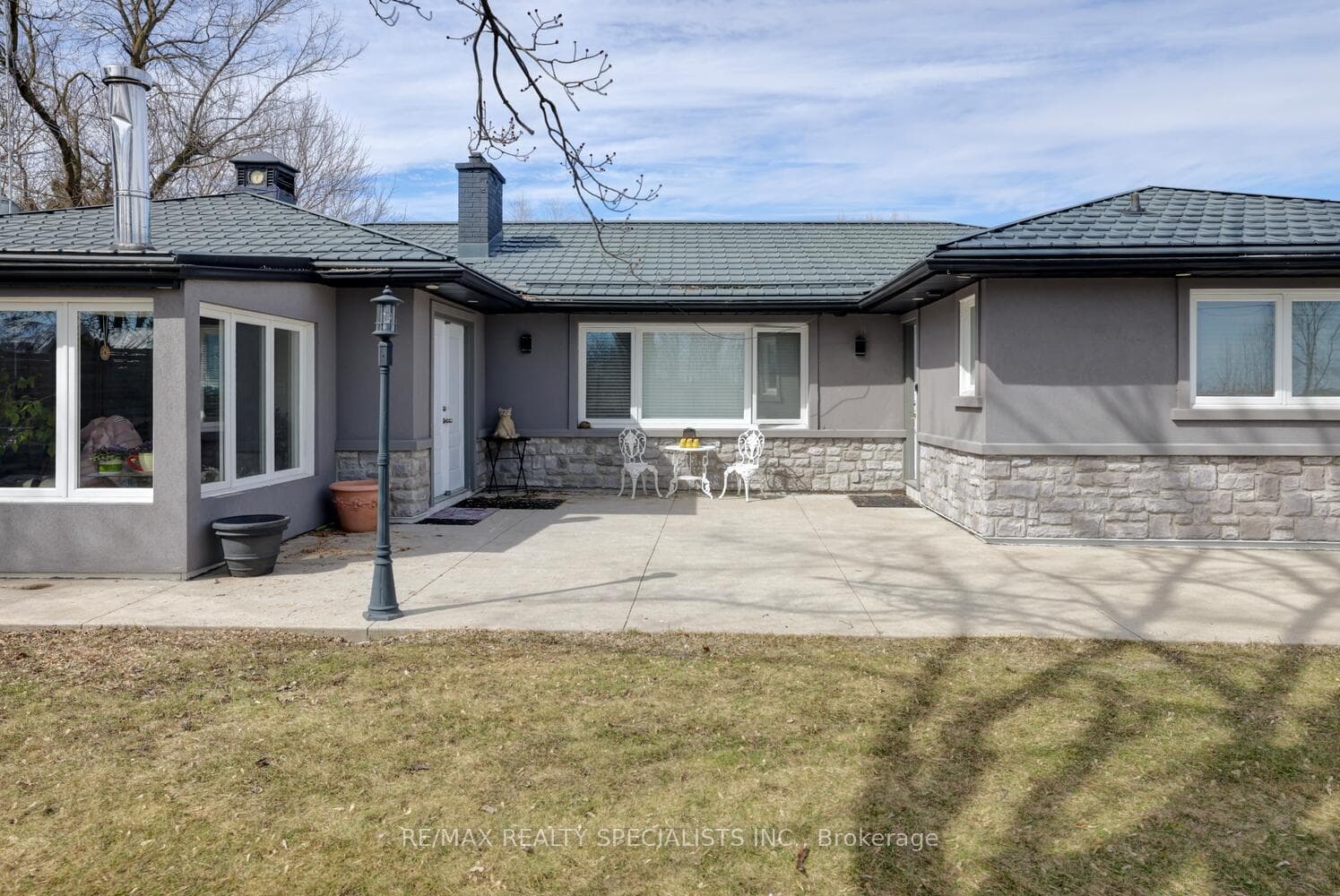 Concrete front patio, concrete walkway.