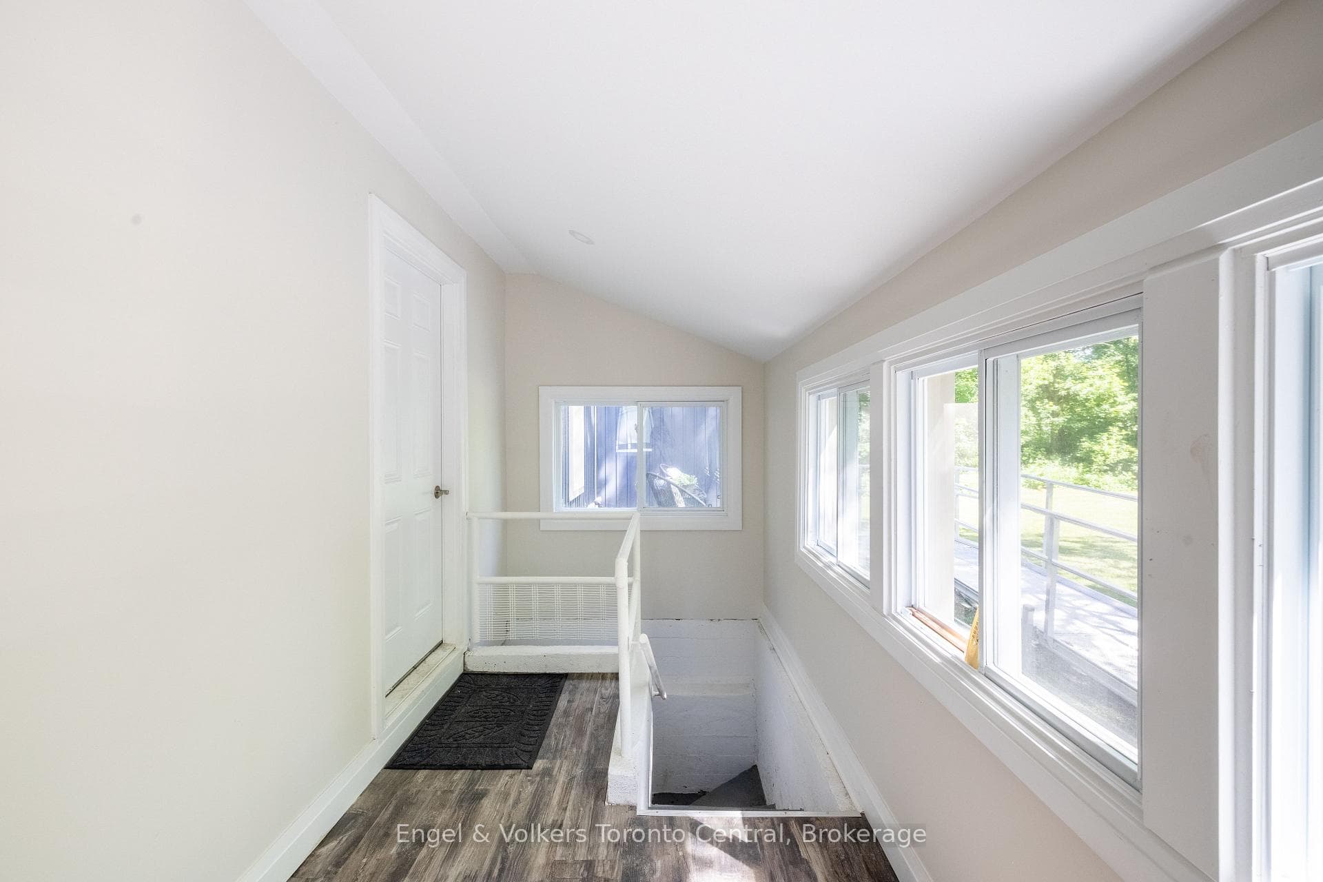 Mudroom with stairs to unfinished basement