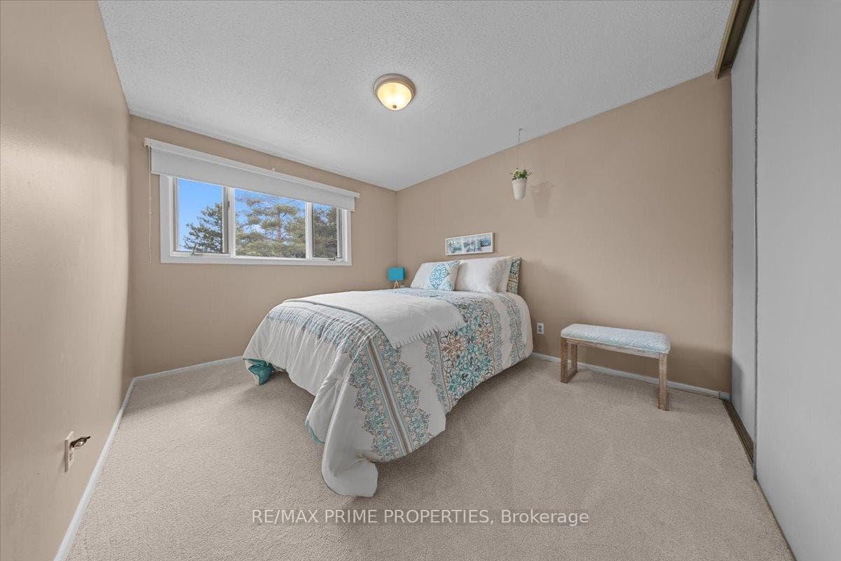 Secondary bedroom with window overlooking park