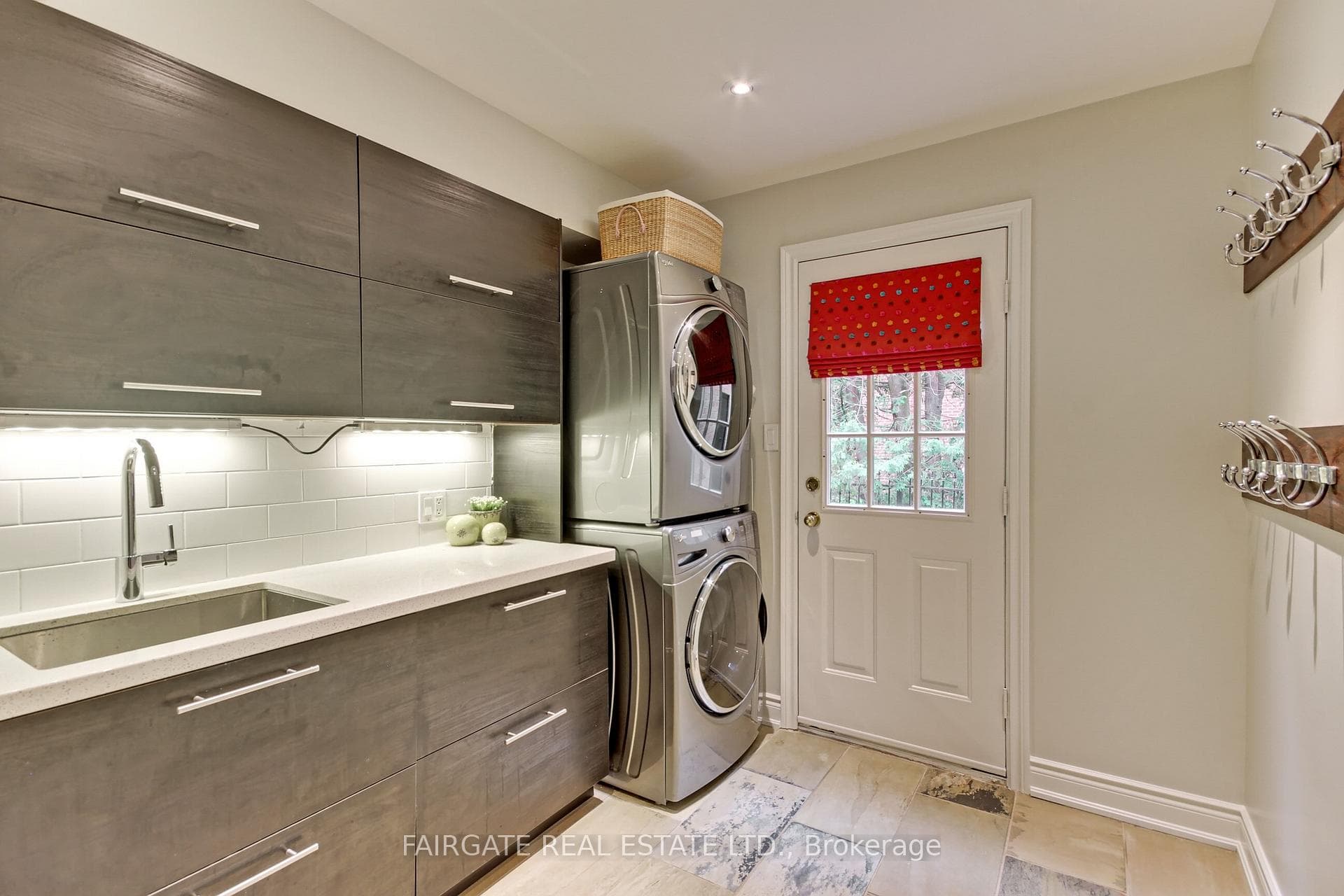Laundry with door to garage & door to yard
