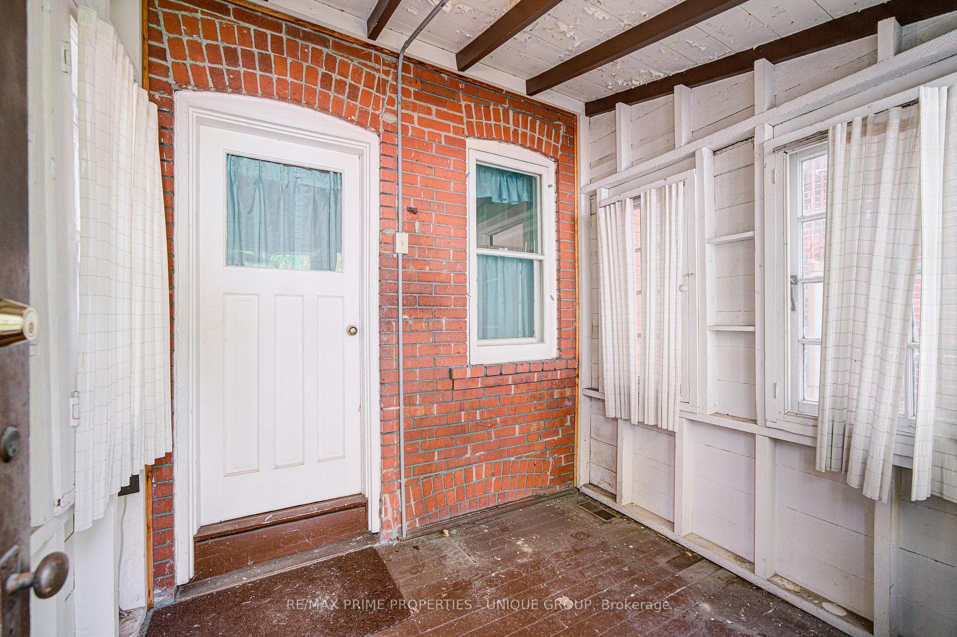 Sunroom with walkout to yard