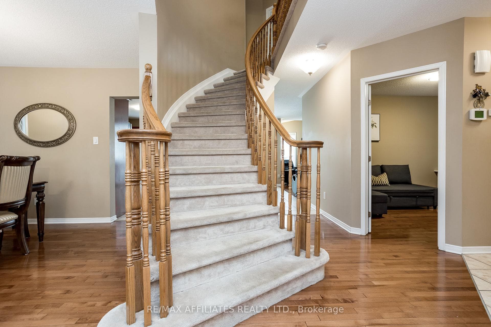 Striking spiral staircase leads to the 2nd level