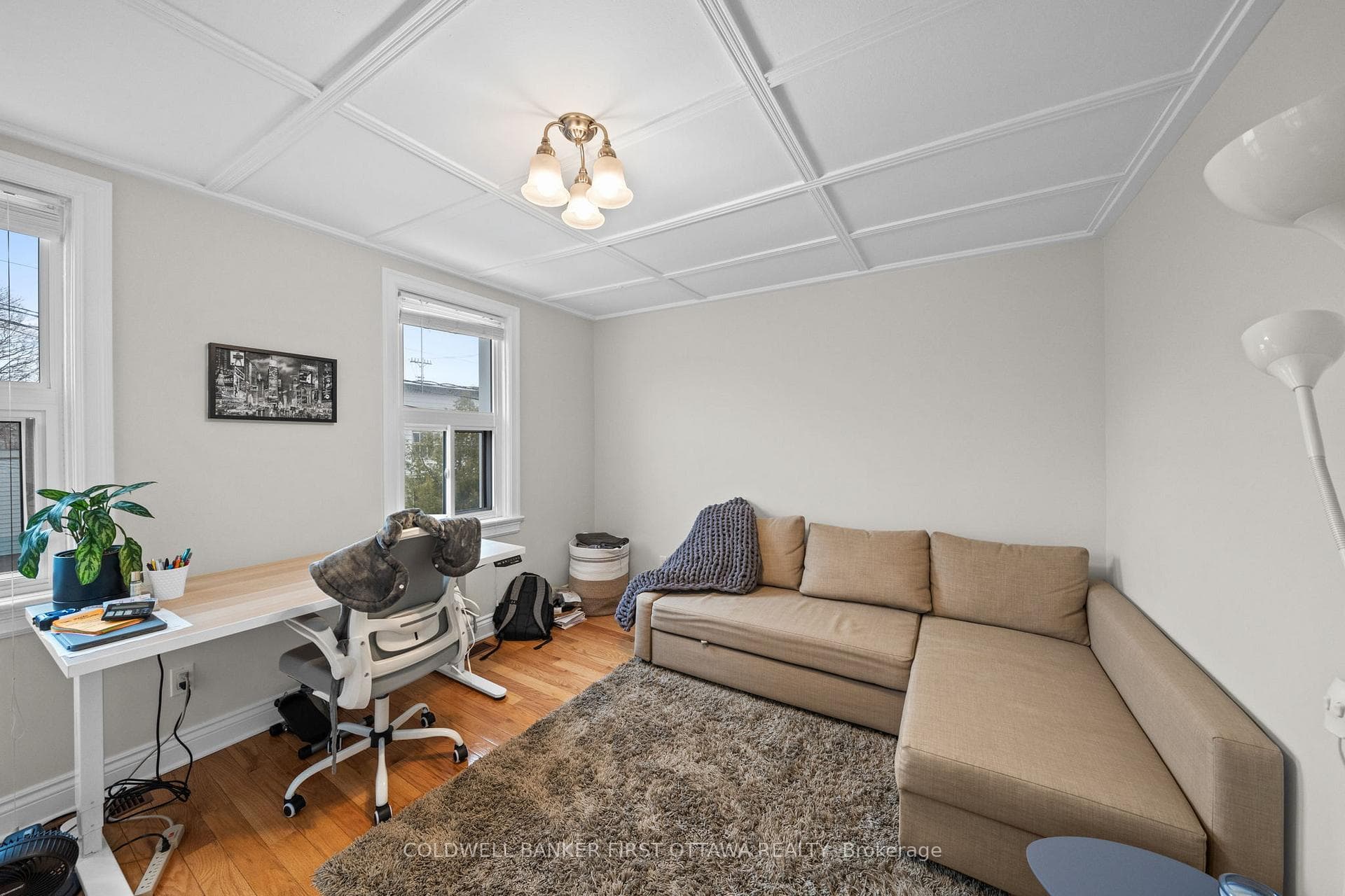 Huge bedroom w surface coffered ceiling & fixture.
