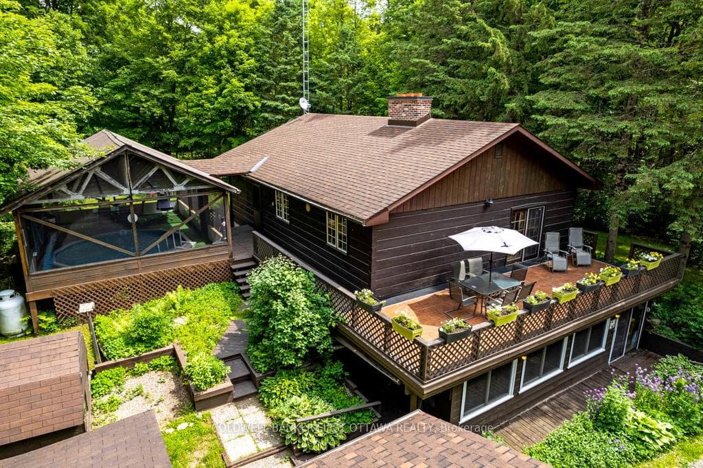 Full of charm, Pan Abode home on 8 woodland acres