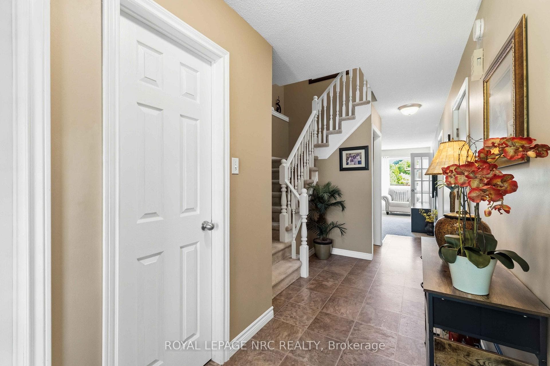 large foyer with walk in closet and powder room