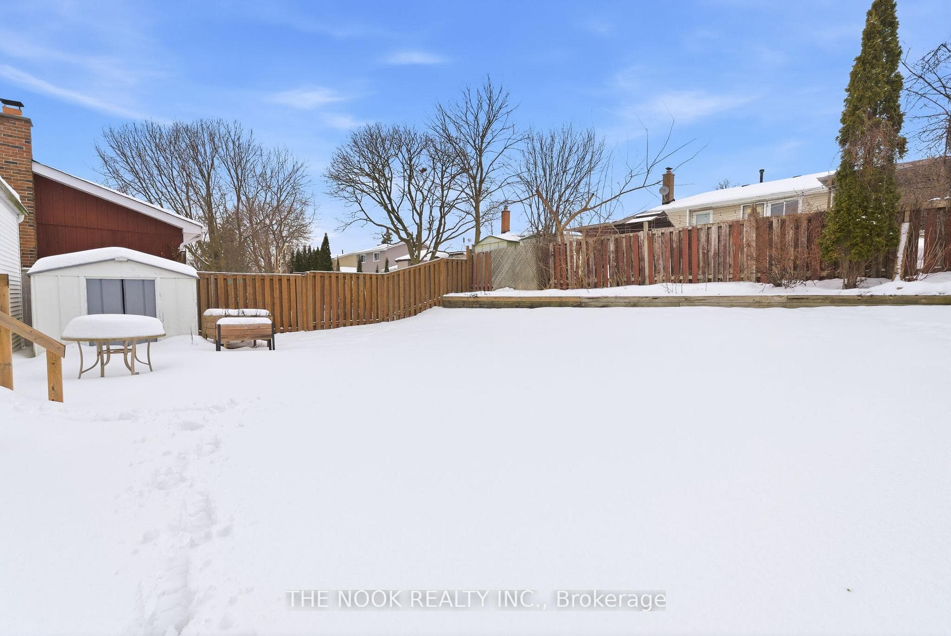 A spacious yard w/ shed & raised garden beds