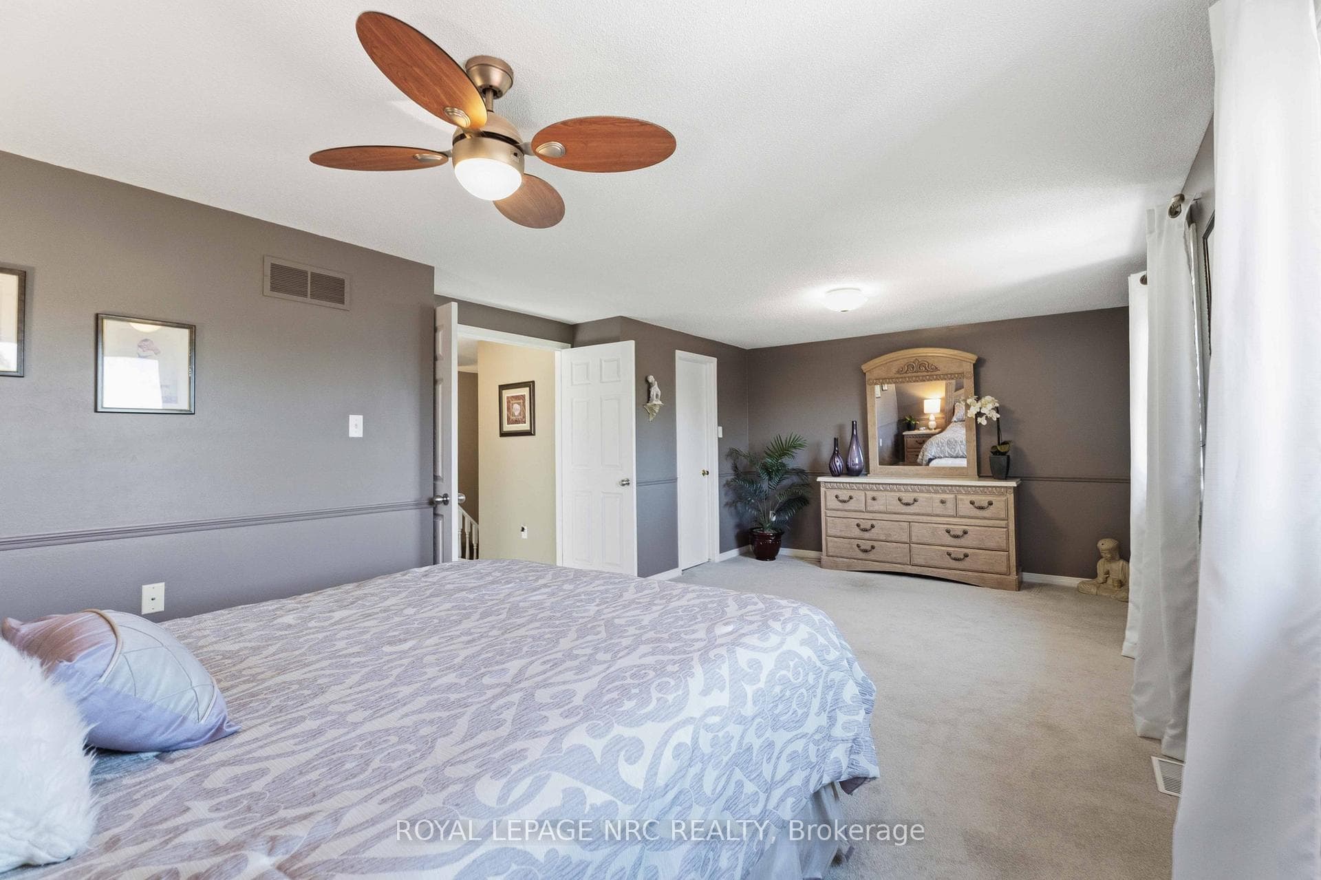 large walk in closet in primary bedroom