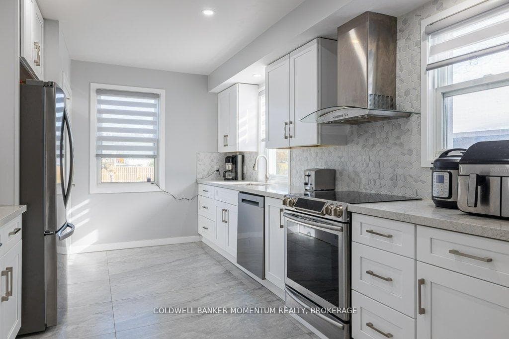 RENOVATED KITCHEN WITH NEWER FLOORING & STORAGE
