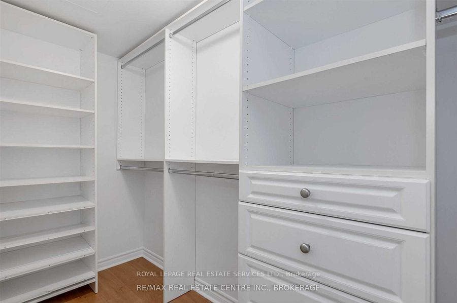 Primary Walk-In Closet With Organizers