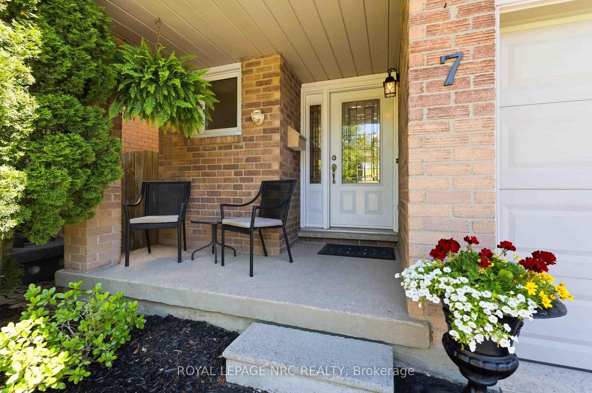 cute sit out front porch to enjoy the gardens