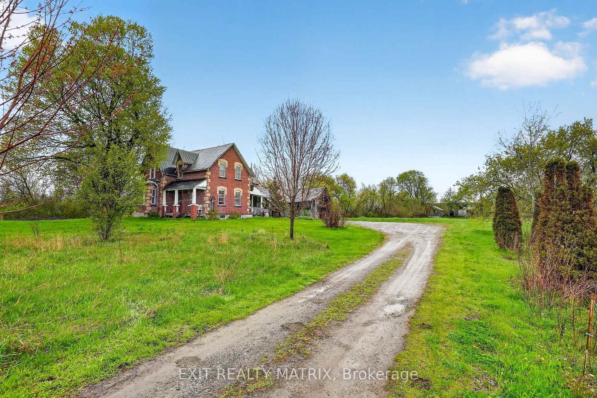 Set back from the road w/ a large berm for privacy