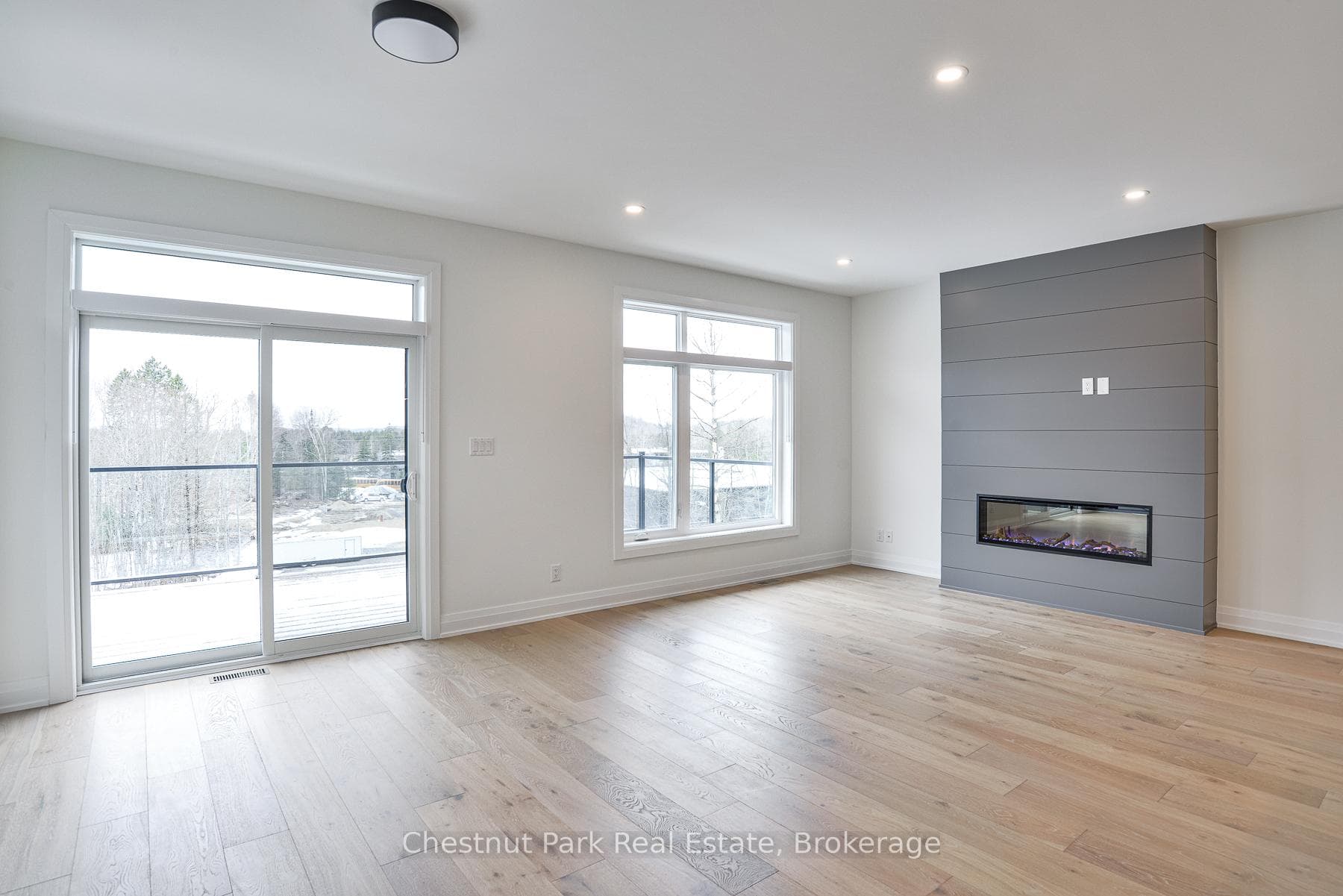 WALK-OUT TO LARGE DECK WITH GLASS PANELS