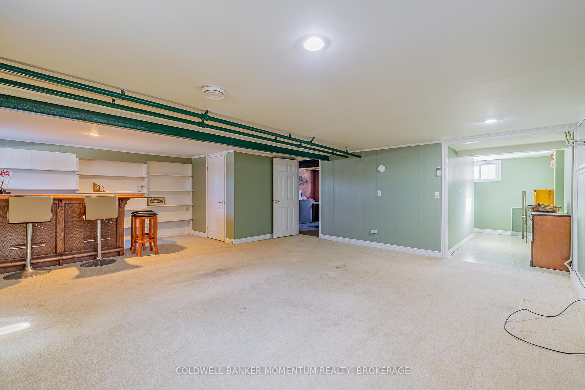 Expansive rec room with bar area