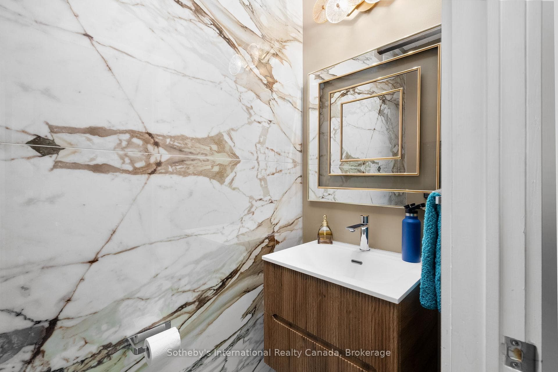 Main Floor Powder Room w/ matching Porcelain Tile.