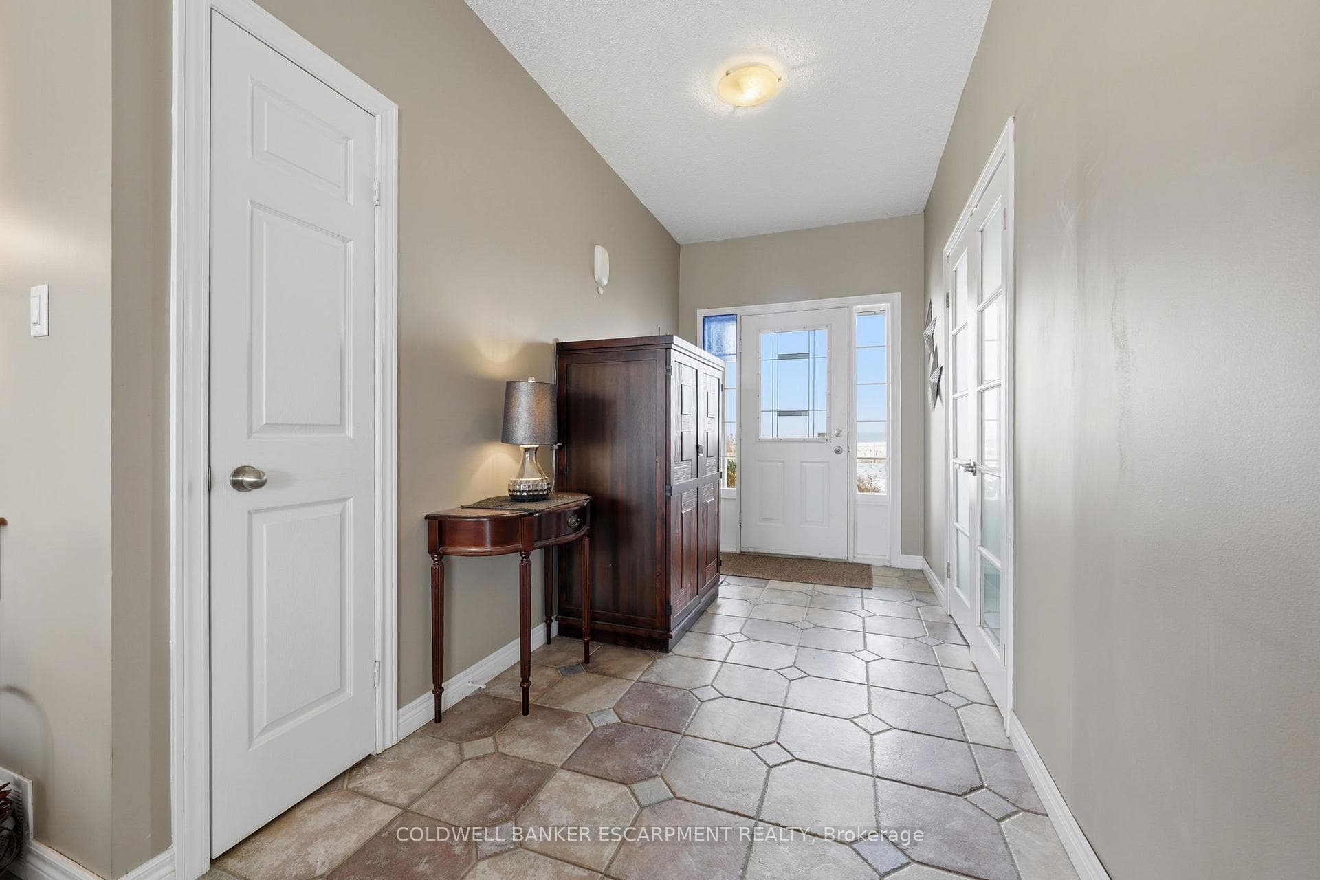 Foyer with garage entrance on left