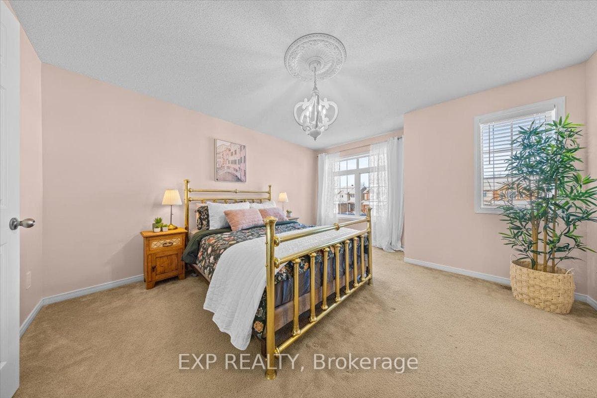 Lovely primary suite with large windows