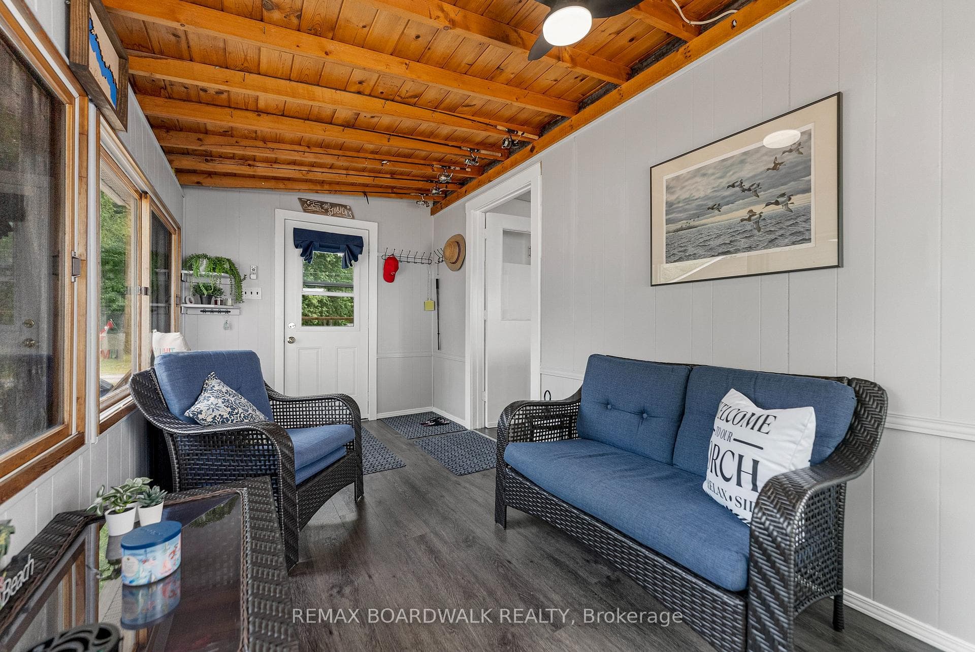 Cozy enclosed porch to unwind in the evening