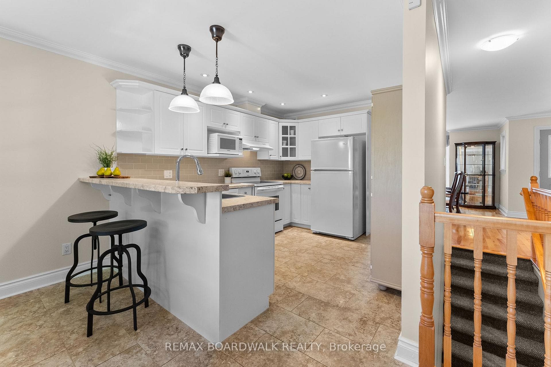 Tastefully updated kitchen with white cabinetry.