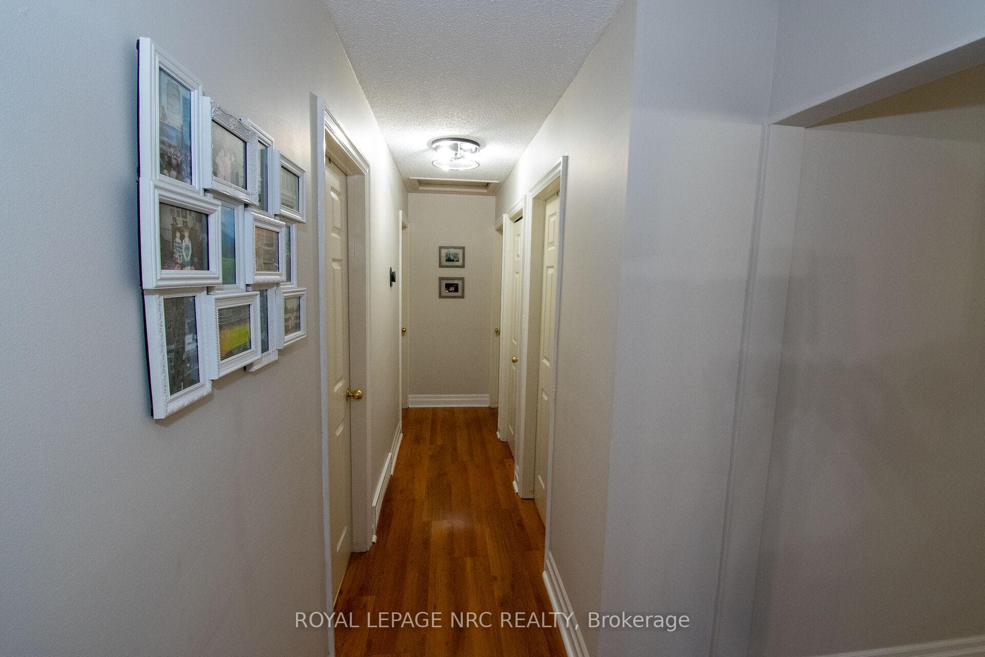 hallway with laminate floors