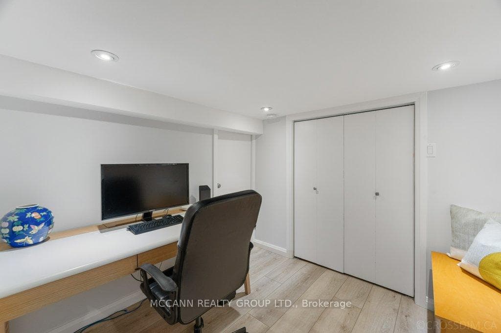 Office area with closet in lower level