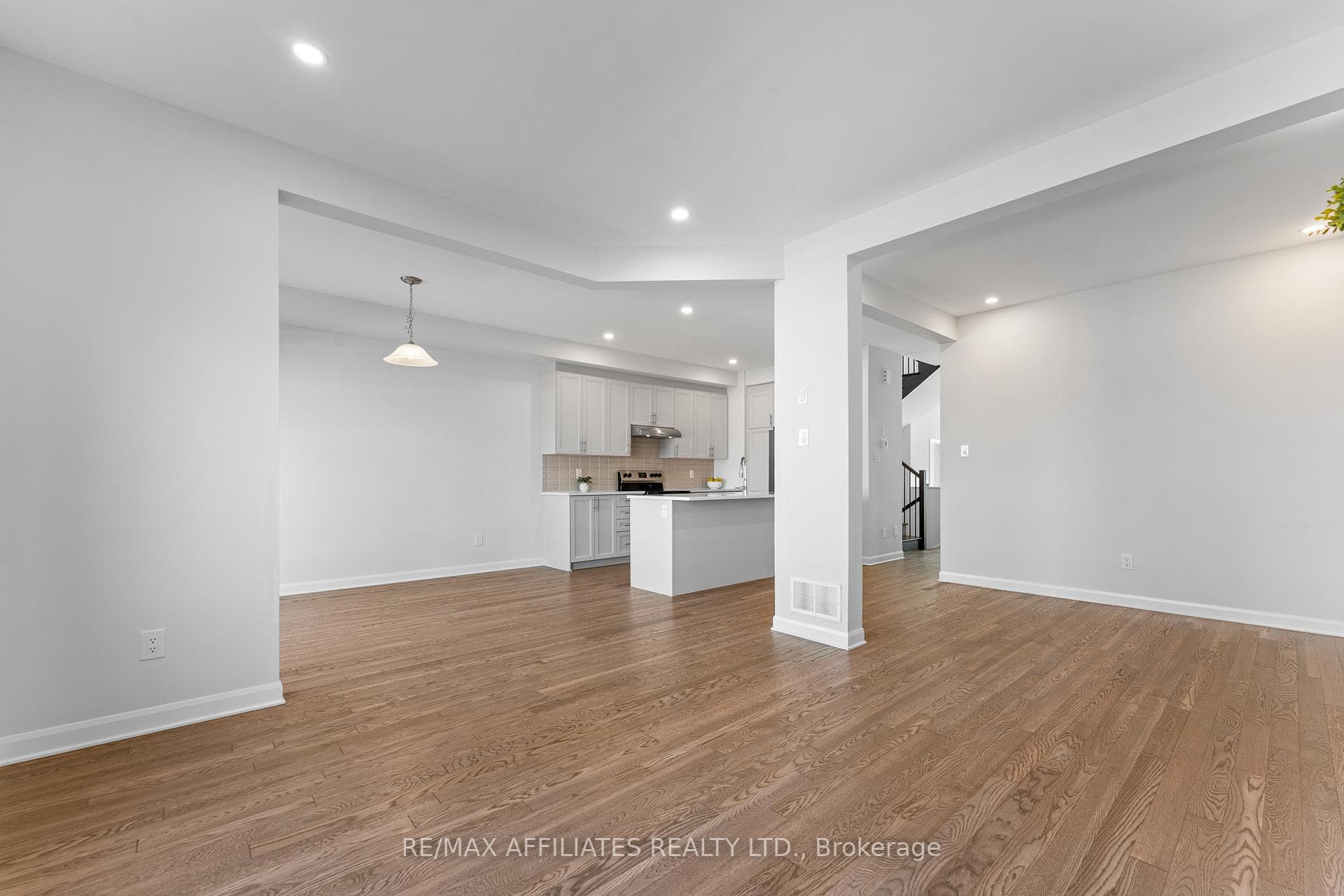 Living Room Open to Kitchen and Dining Room