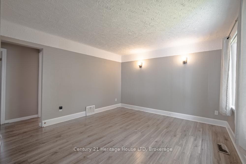 Living Room ~ Laminate Floors and Wall Sconces.