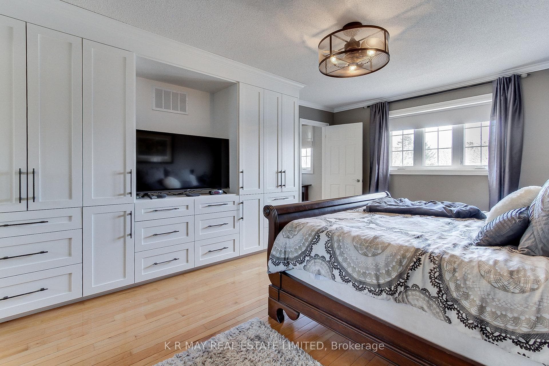Custom cabinetry with drawers and tv area