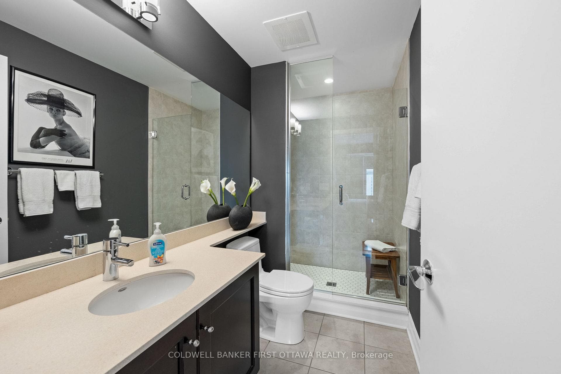3 pc en suite bathroom w stand up glass shower.