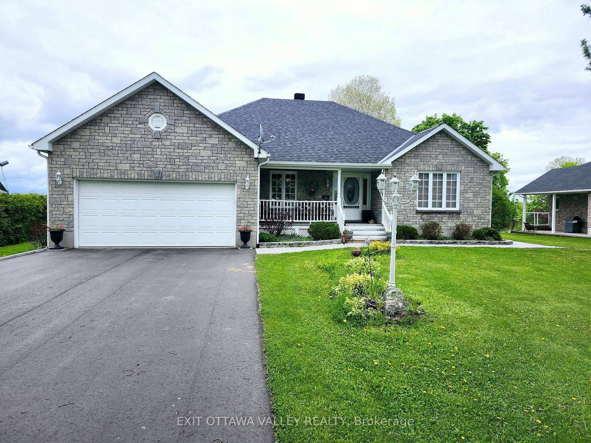 Front of house, front porch and stone walkway.
