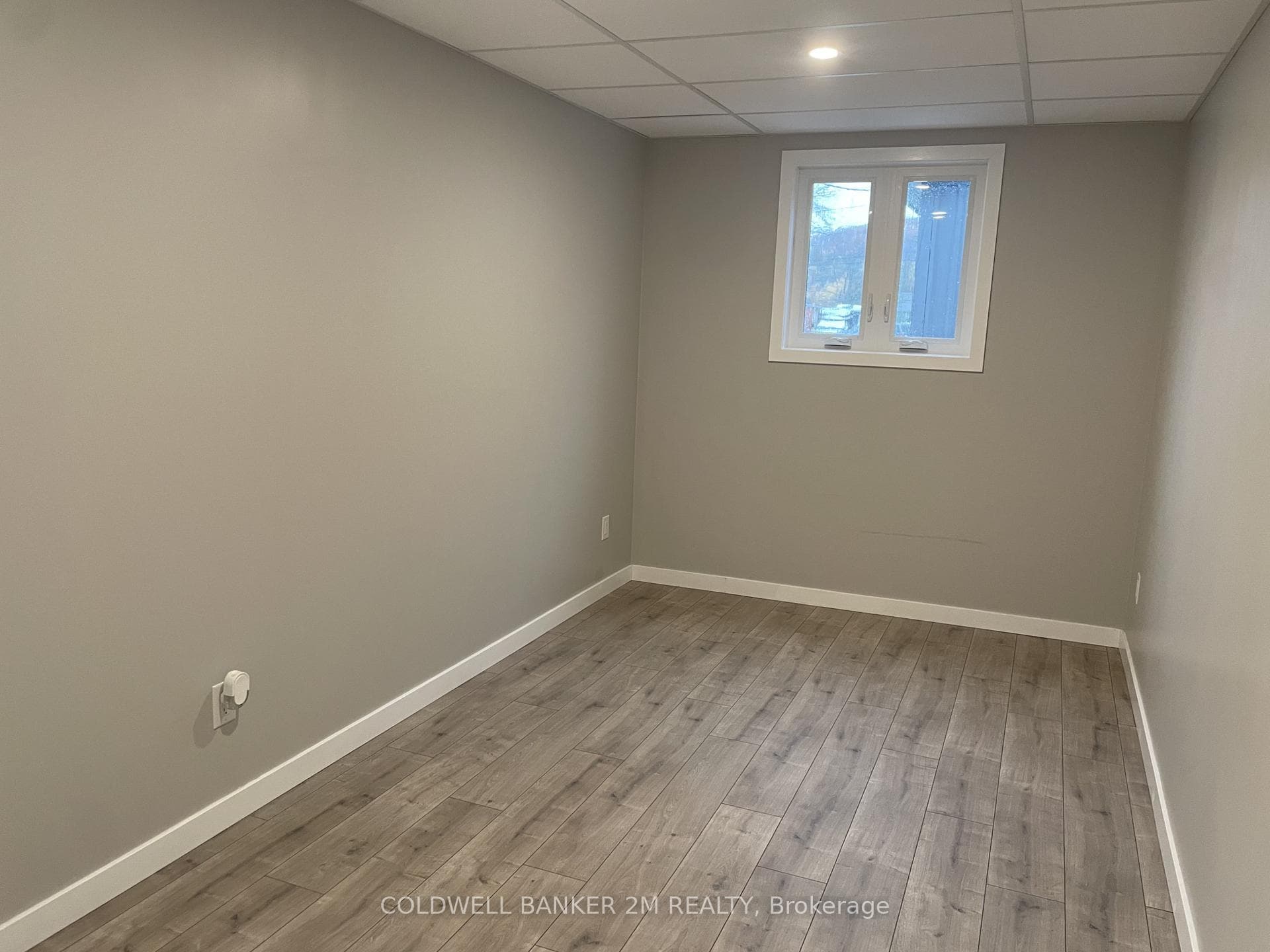 Bedroom with Large Window & Closet.